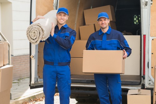 Packed moving boxes and furniture ready for transport in Southborough