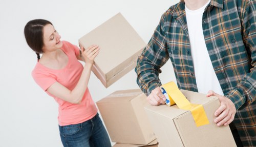 Packed boxes and furniture ready for a professional removals service
