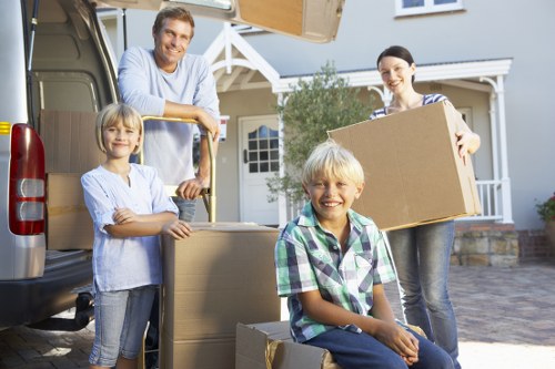 Southborough moving team loading boxes and furniture near a residential street