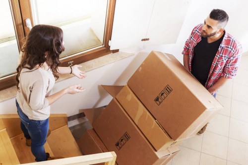 Professional movers loading furniture for a house move in Southborough