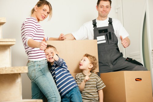 Professional movers handling desks and office equipment in Southborough